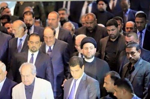 Image - Maliki laughs at the funeral of Chalabi